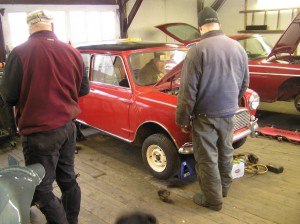 Mini conference Butch watches while John & Patrick crank the Mini