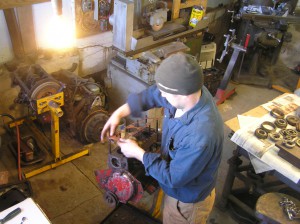 PMC XPAG Patrick lifts the old XPAG head gasket over the studs