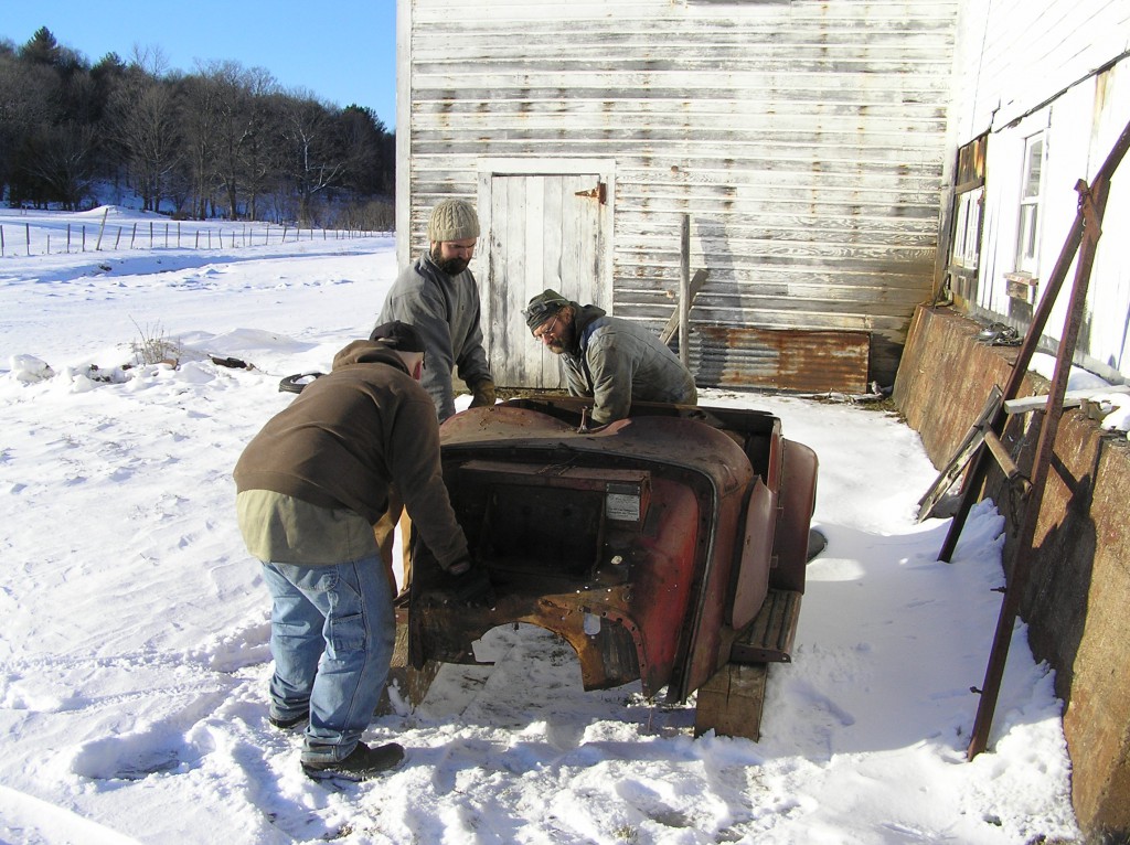 TD touchdown John, Patrick & Steve settle a TD body tub behind the shop