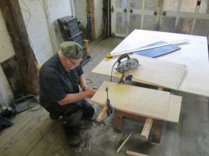 Butch marks out new plywook floors