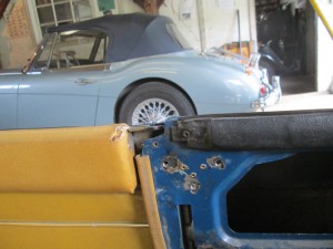 A tapping plate pop-riveted in place